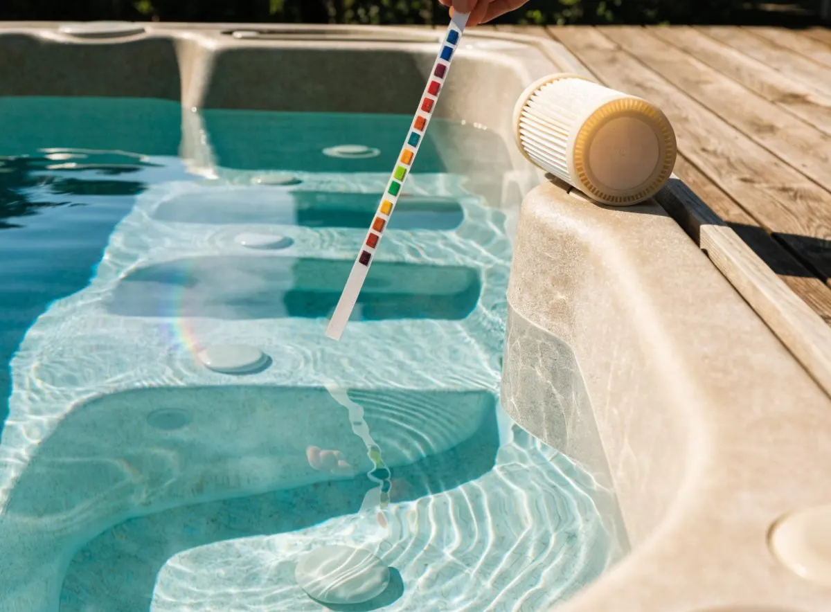 Clear hot tub water with a test strip and a clean filter cartridge